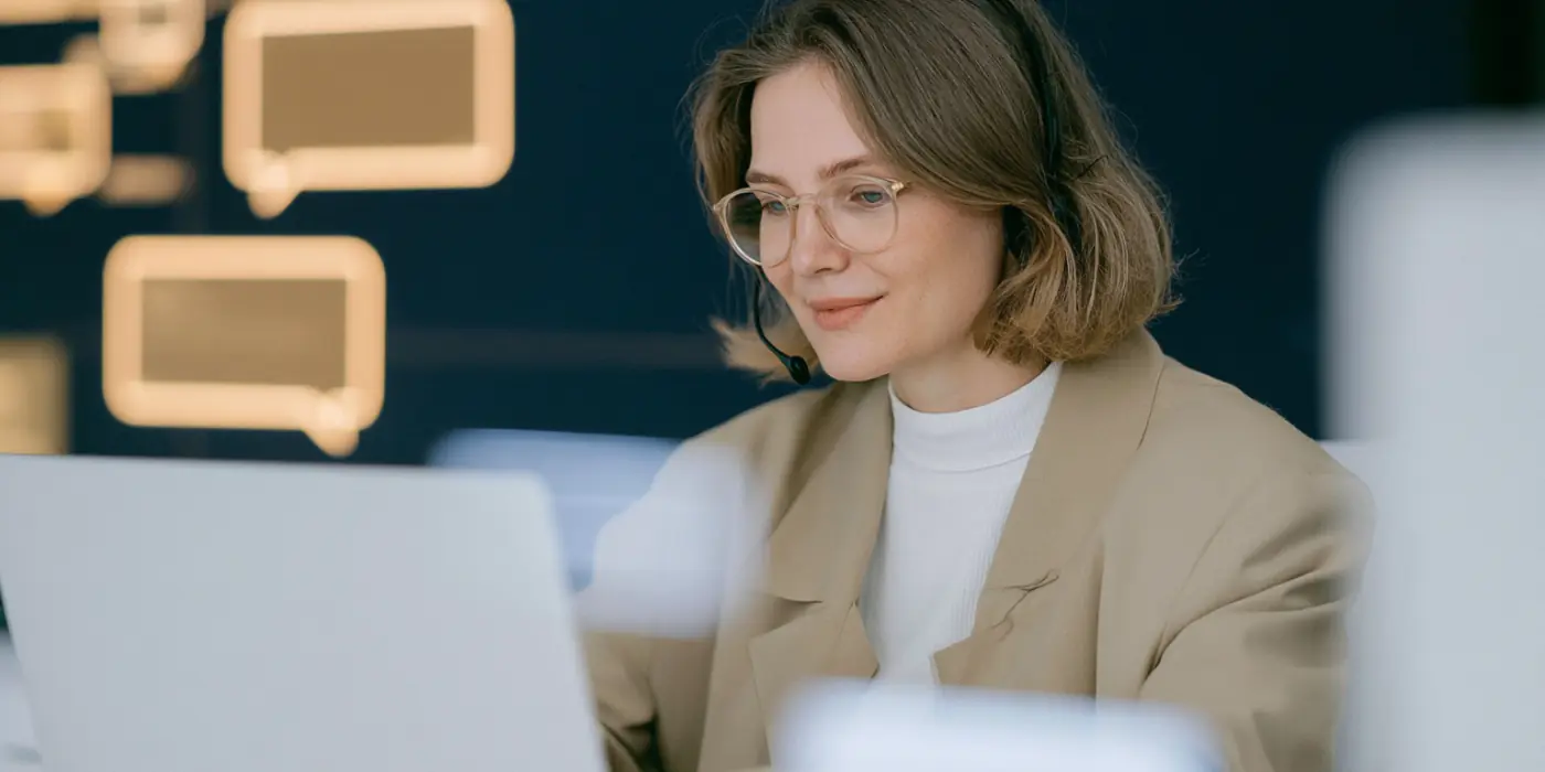Customer support specialist handling a collections conversation from a digital workspace