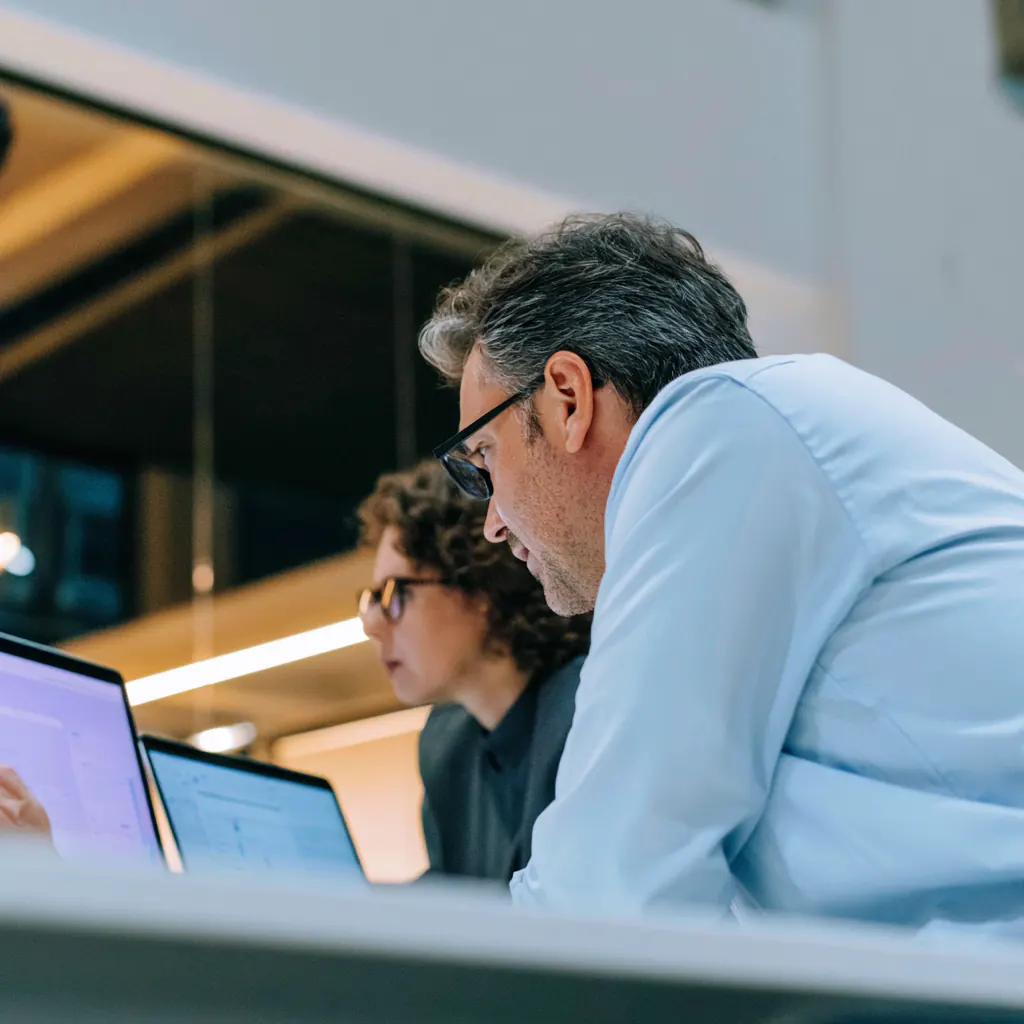 Risk specialists reviewing evidence in a digital decision workspace